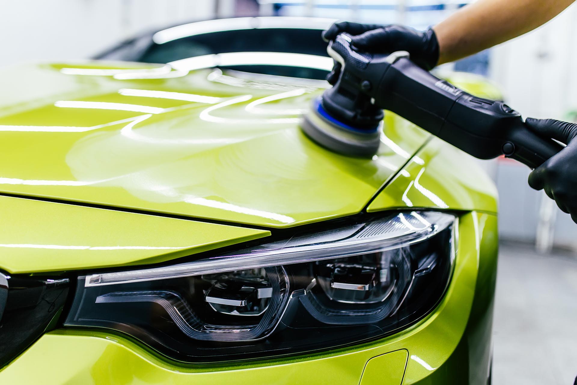 Polishing a green BMW